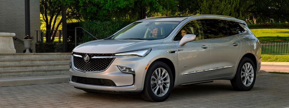2022 Enclave Avenir parked outside a home.