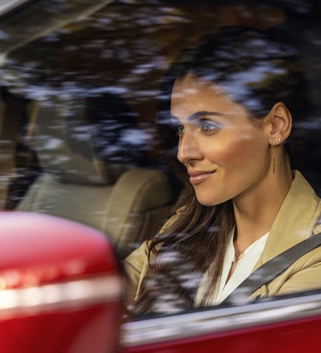 Woman driving a 2022 Buick Enclave.