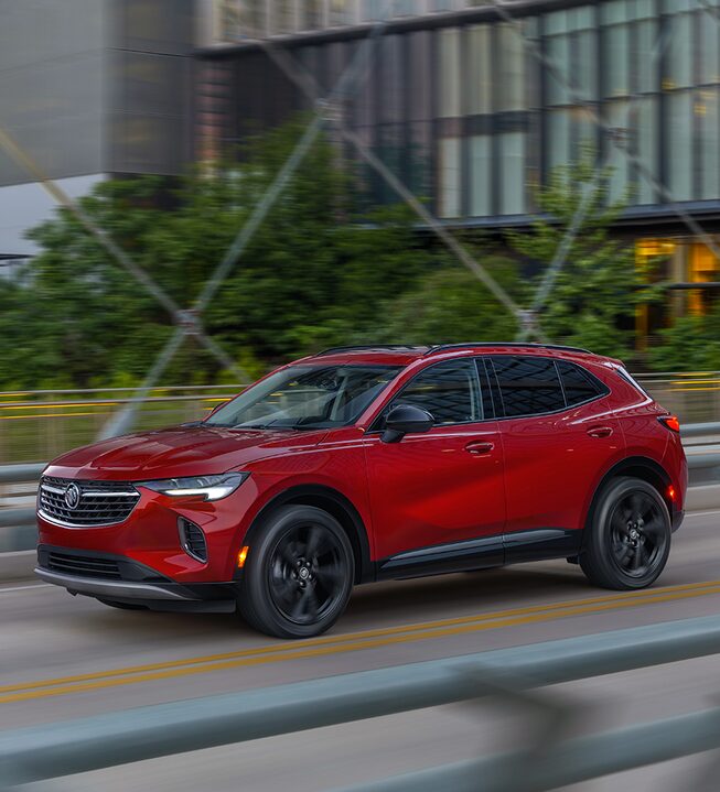 2023 Envision Sport Touring driving on the road.
