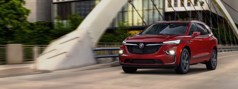 2023 Buick Enclave ST driving on the road.