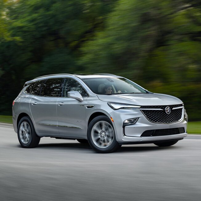 2022 Buick Enclave driving on the road.