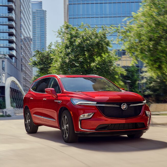 2022 Buick Enclave Sport Touring driving on the road.