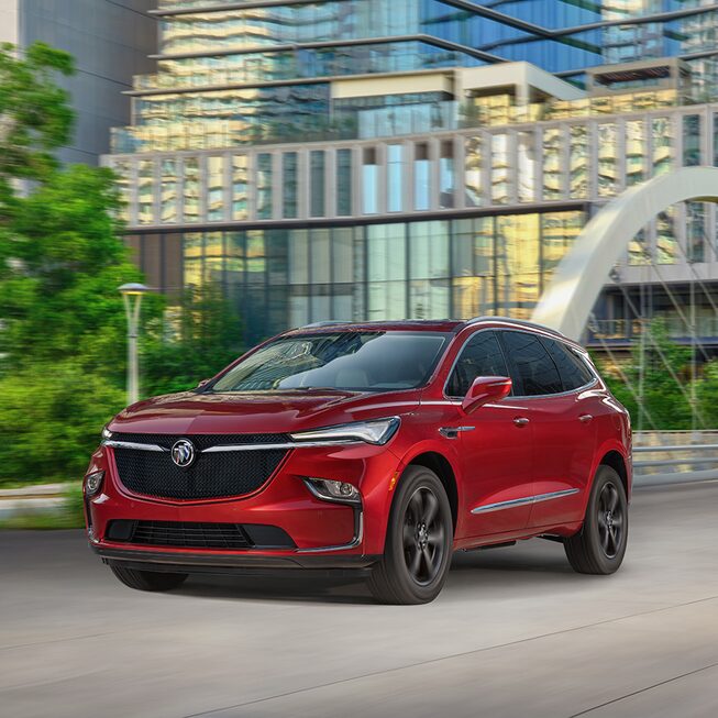 2022 Buick Enclave Sport Touring driving in the city.