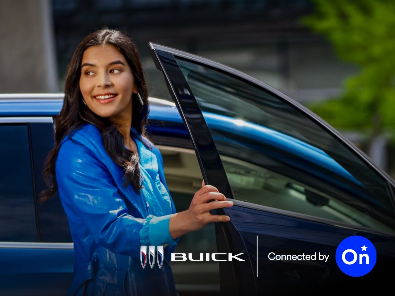 Two people exiting an OnStar-subscribed Buick vehicle.