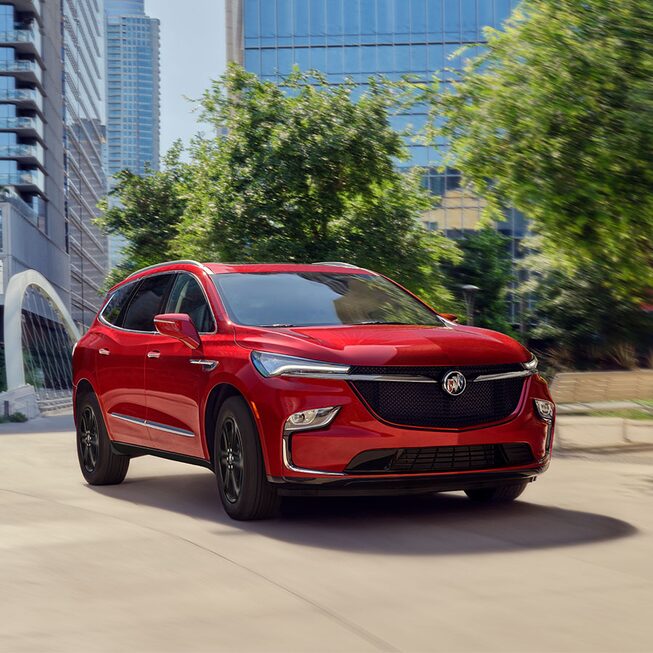 2023 Buick Enclave Sport Touring driving on the road.