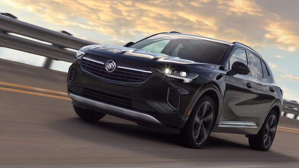2023 Envision driving on the road.