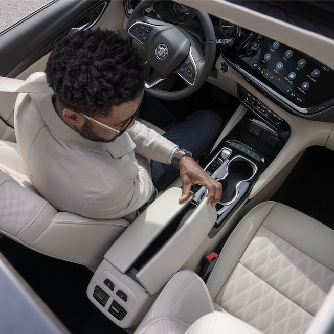 2023 Buick Envision Avenir center console and armrest.