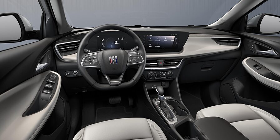 2024 Buick Encore GX ST front interior in Whisper Beige with Ebony Accents.