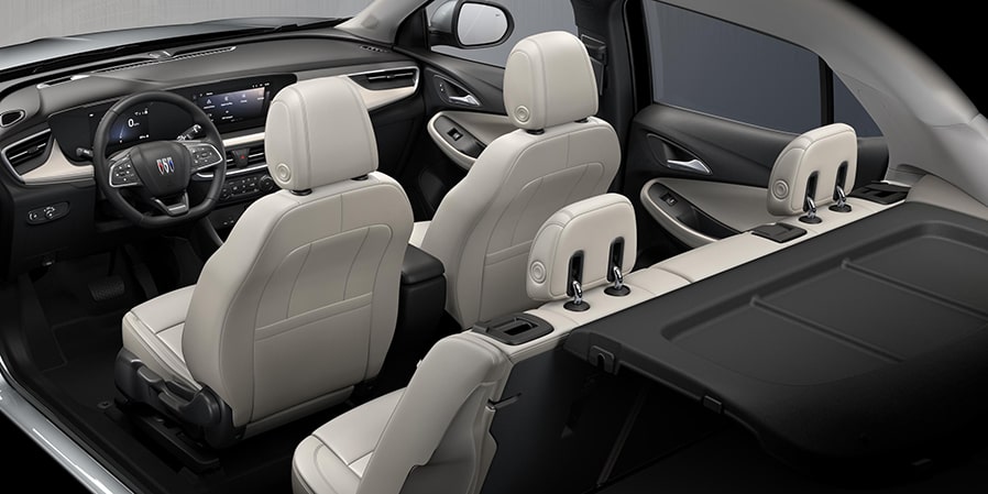 2024 Buick Encore GX ST interior seats in Whisper Beige with Ebony Accents rear view.