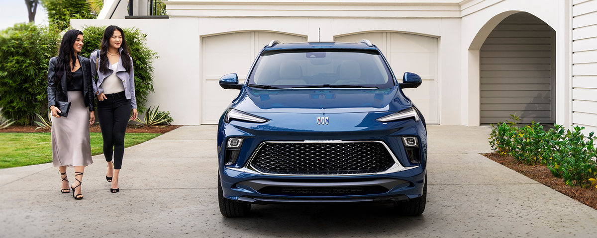 Front view of the 2024 Encore GX Avenir parked outside.