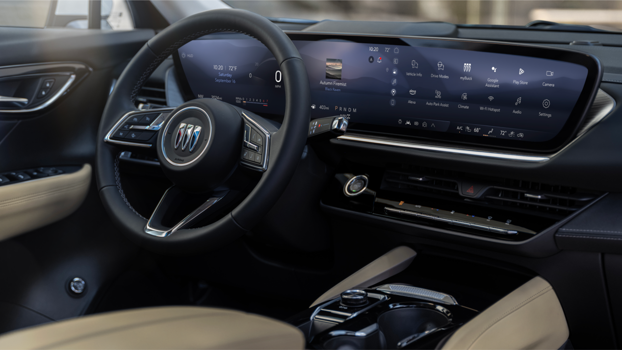 2024 Envision front interior featuring the steering wheel and infotainment system.