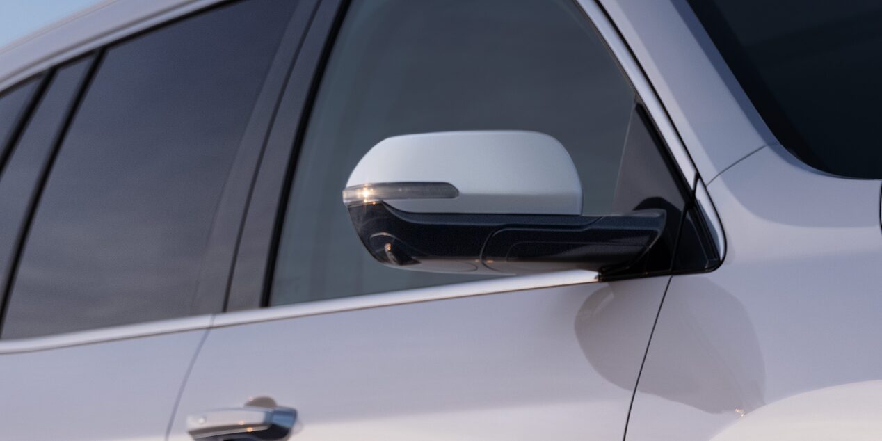 2025 Buick Enclave Avenir exterior featuring side mirrors.