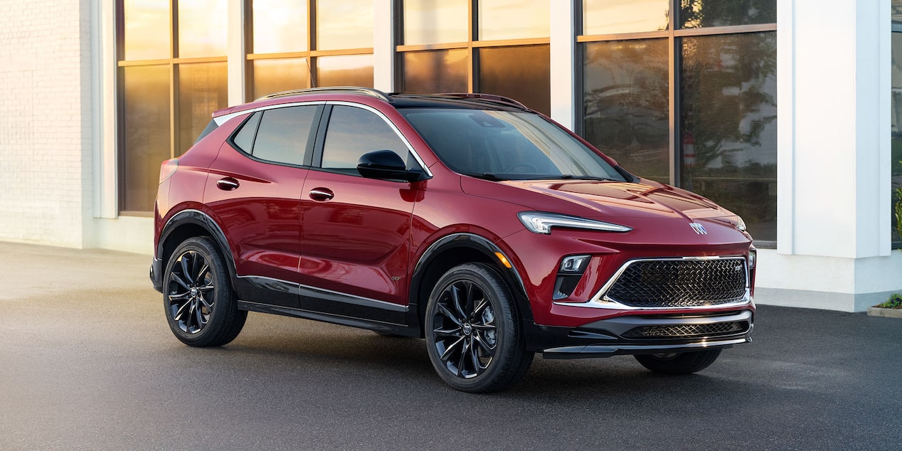 Front-side view of the 2025 Buick Encore GX ST parked outside a building.