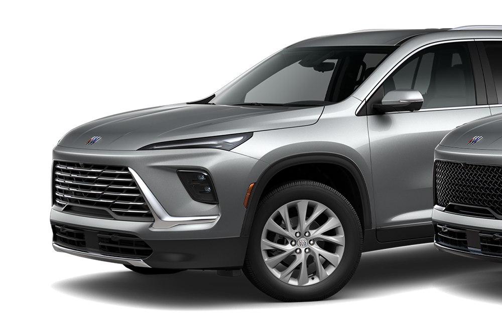 Front-side view of three 2026 Buick Enclave Mid-Size SUVs positioned next to each other.