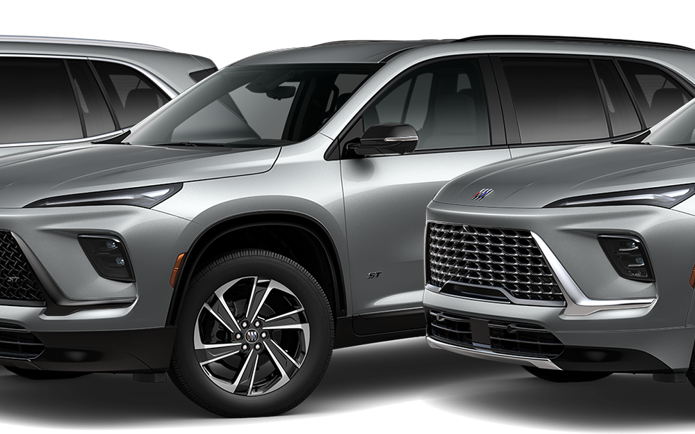 Front-side view of three 2026 Buick Enclave Mid-Size SUVs positioned next to each other.