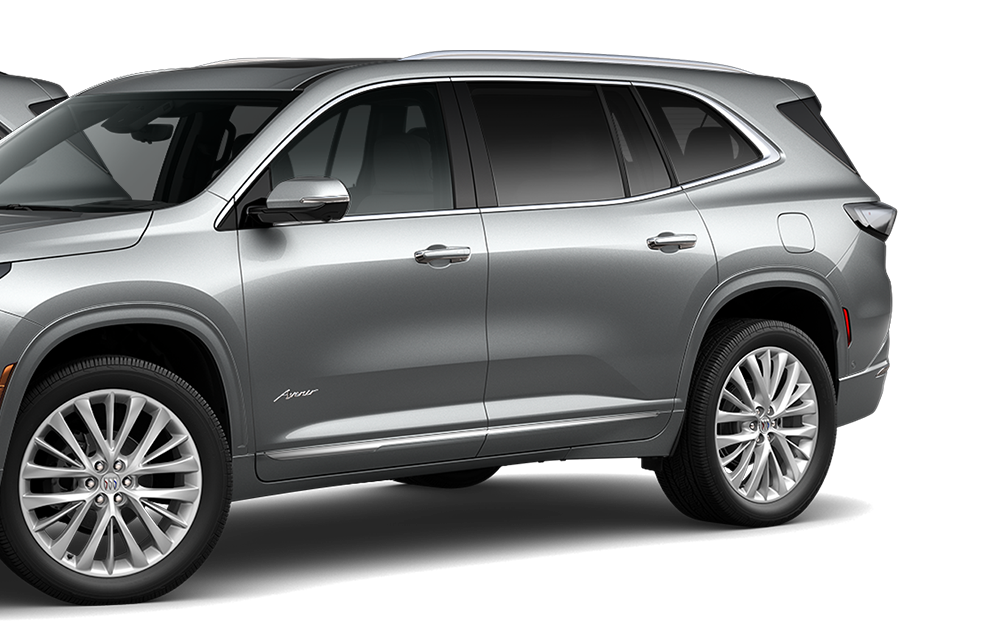Front-side view of three 2026 Buick Enclave Mid-Size SUVs positioned next to each other.