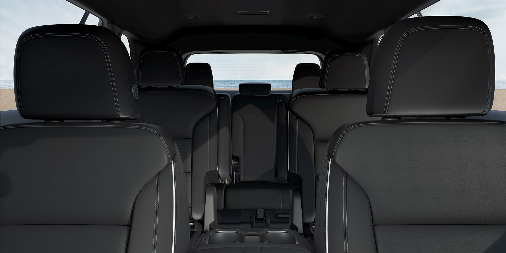 Vue intérieure  de l'avant vers l'arrière, d'une VUS Buick Enclave 2026.