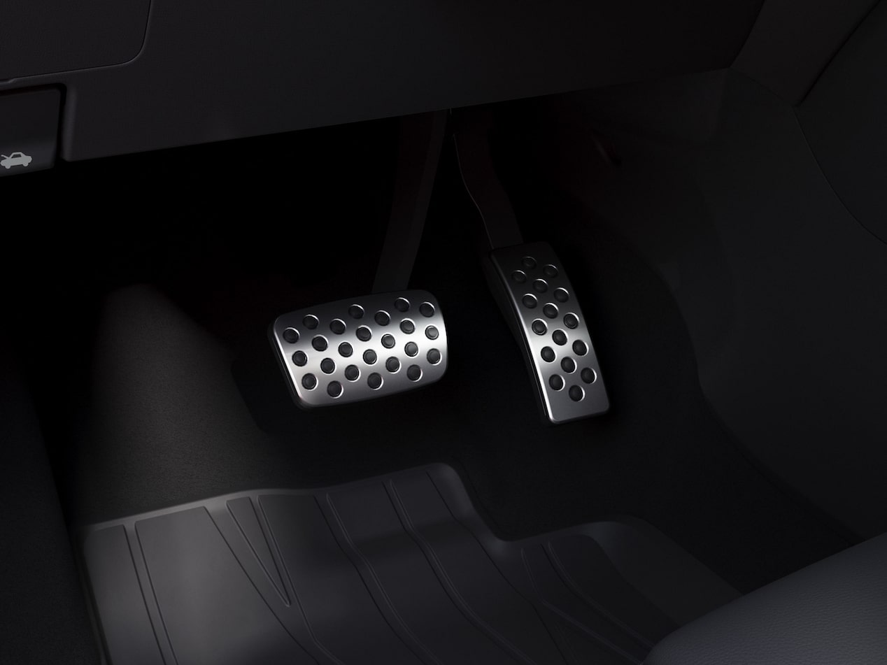 Side view of the 2026 Buick Encore GX ST parked alone by the beach.