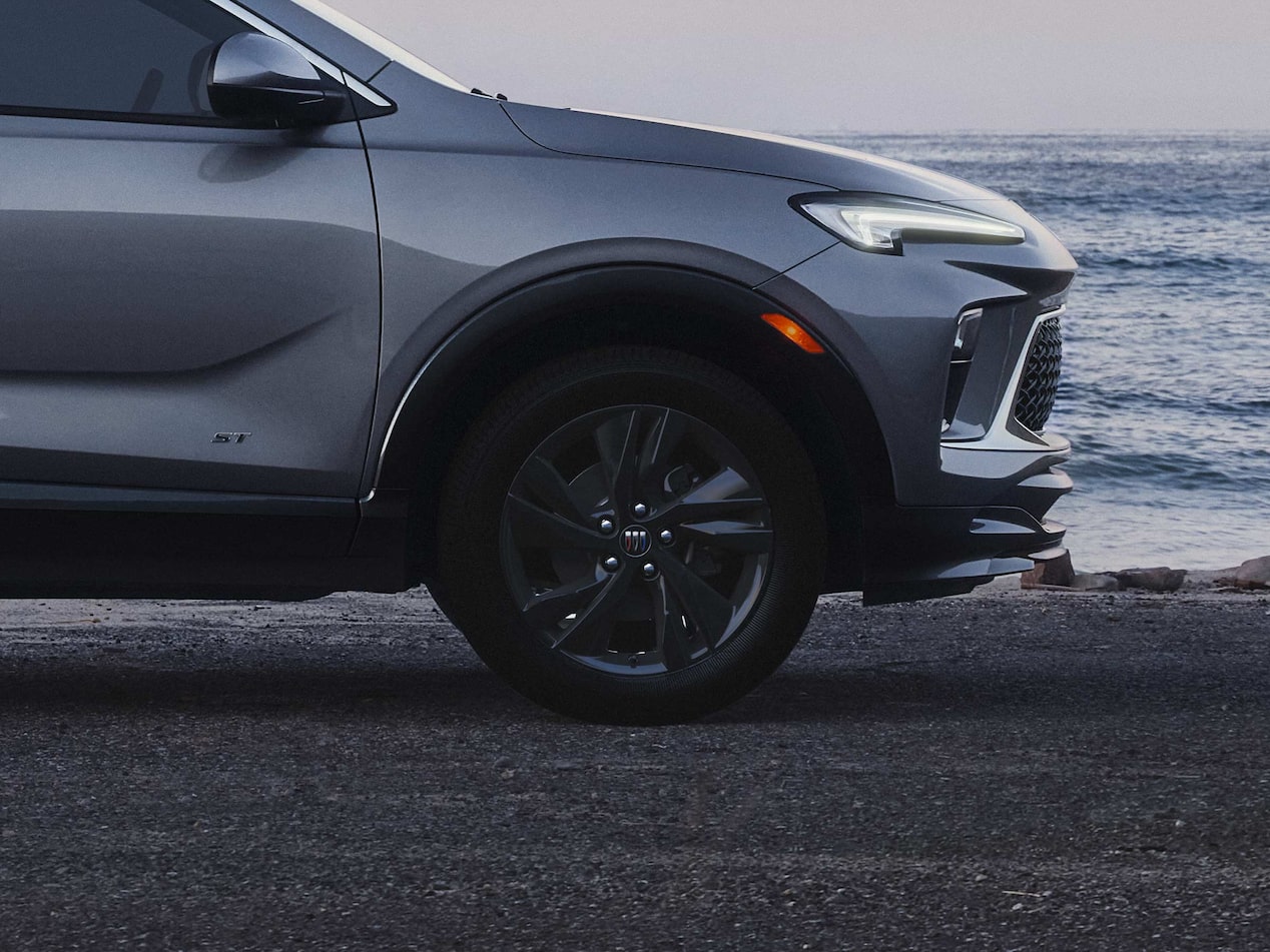 Side view of the 2026 Buick Encore GX ST parked alone by the beach.
