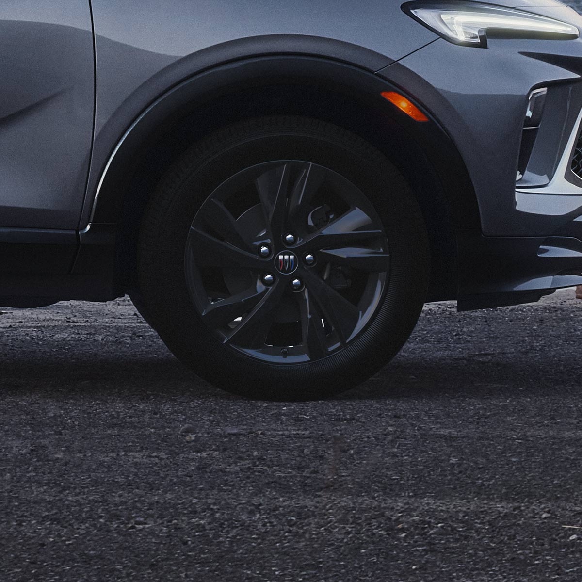 Side view of the 2026 Buick Encore GX ST parked alone by the beach.