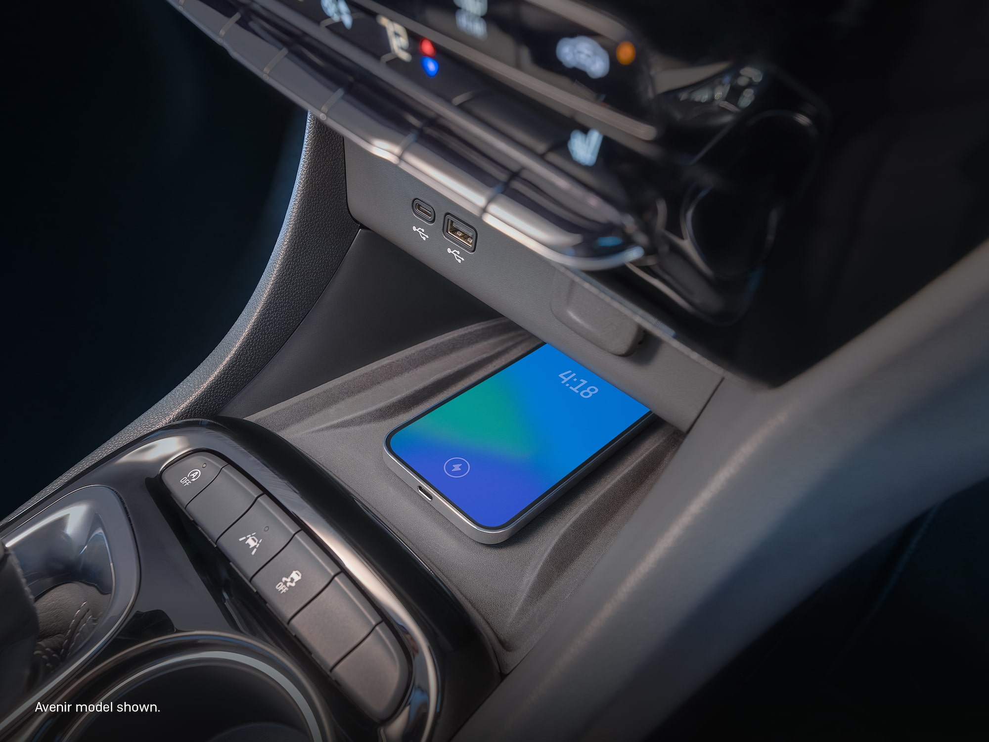 A smartphone charging inside the 2026 Buick Encore GX ST.
