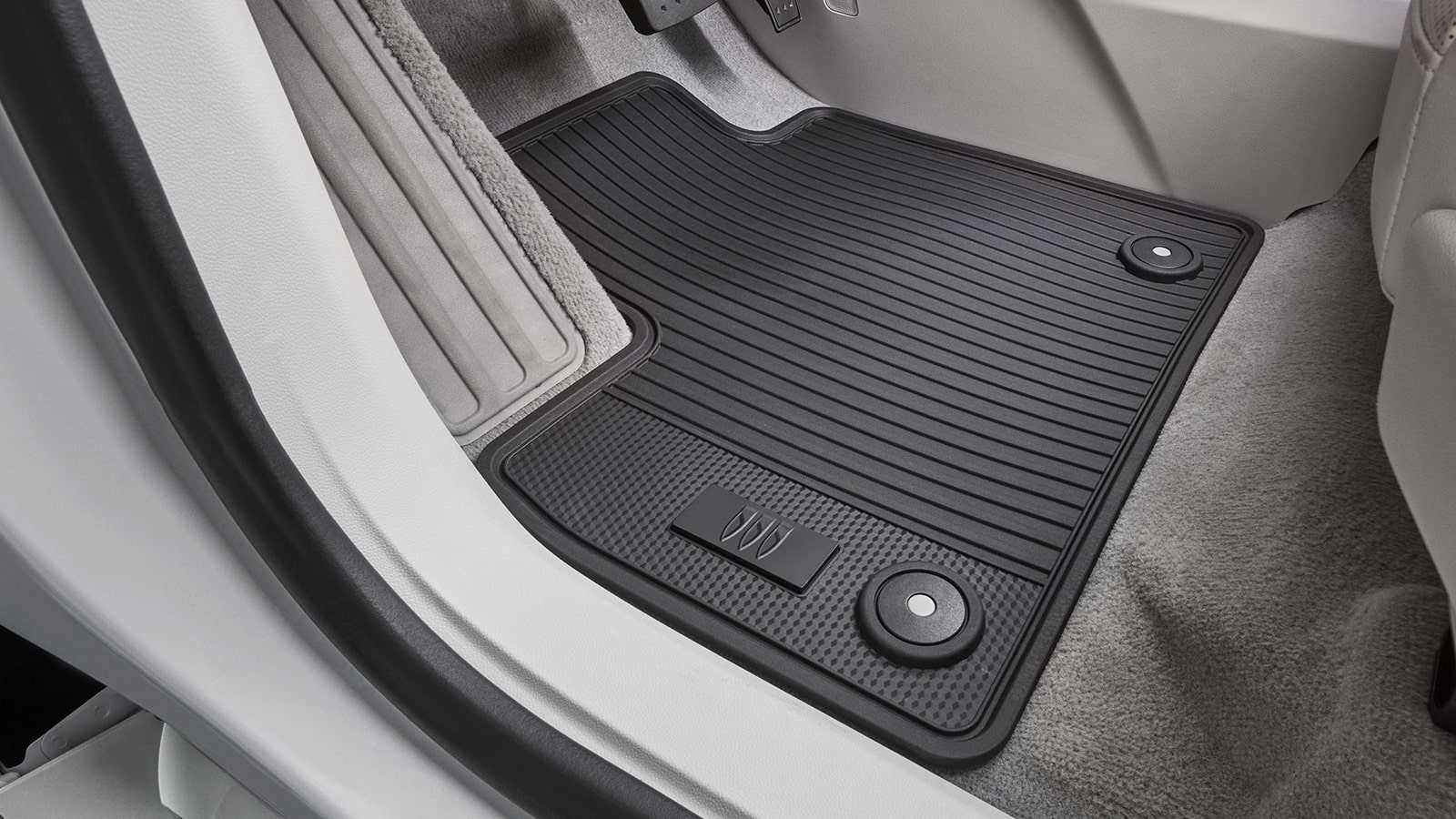 A Close-up of a Black All Weather Floor Mat with a Buick Logo Design inside the 2027 Buick Enclave Avenir.