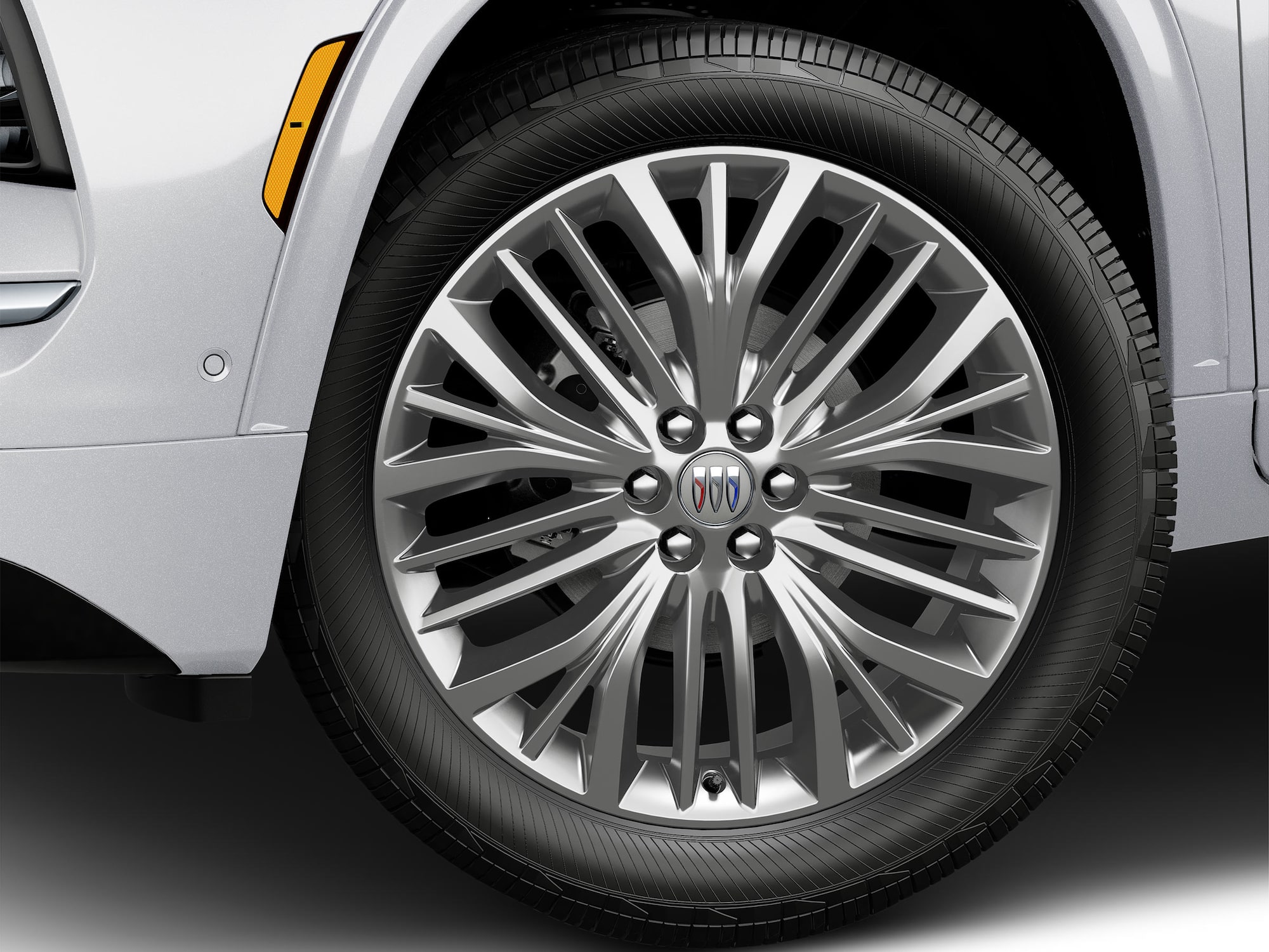 A Close-Up View of a 2027 Buick Enclave Avenir Wheel with a Chrome Finish and the 2027 Buick Tri-Shield Logo.