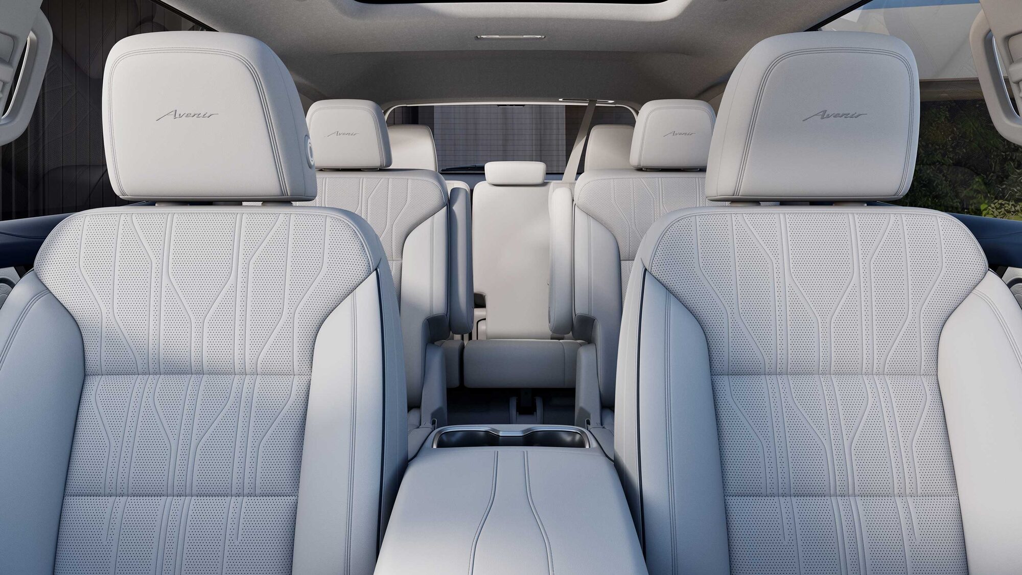 Vue rapprochée d’un siège d’auto en cuir blanc perforé de la Buick Enclave Avenir 2027.