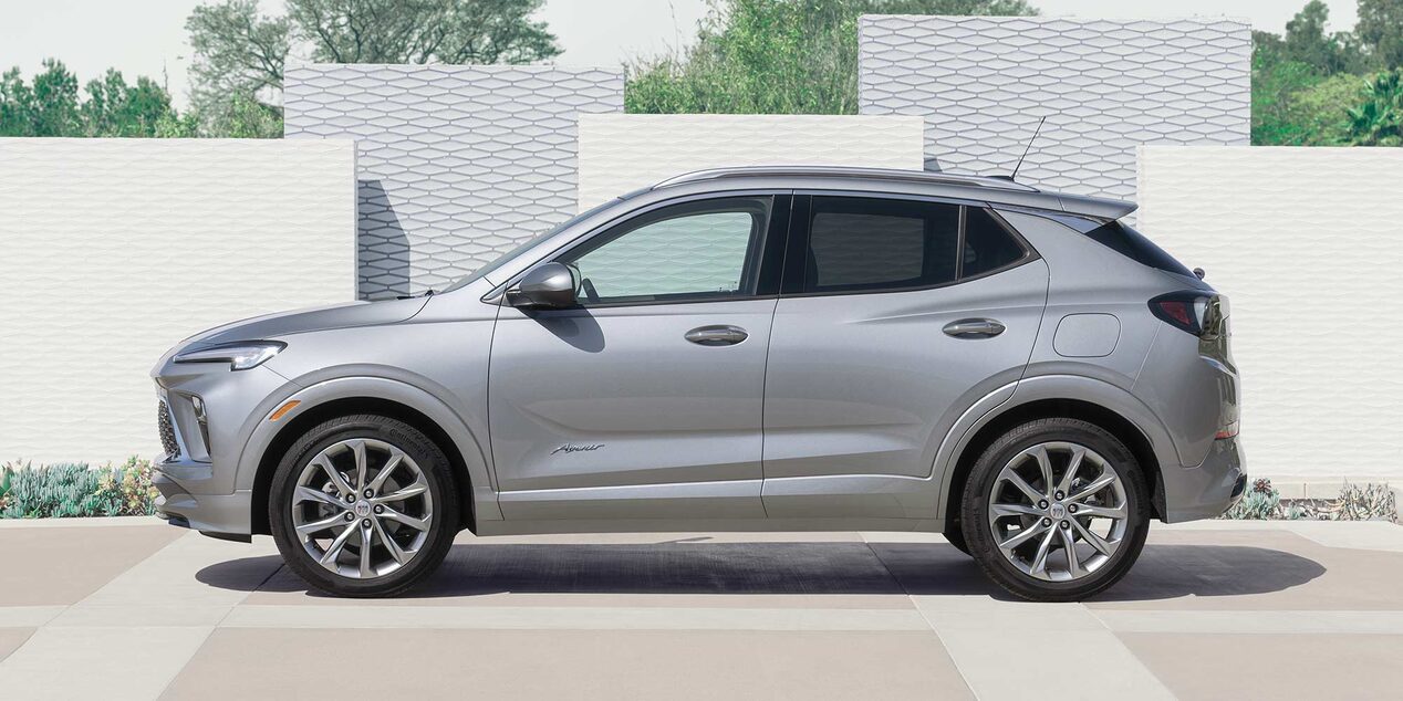 Side view of the 2025 Buick Encore GX Avenir parked near vertical blocks.