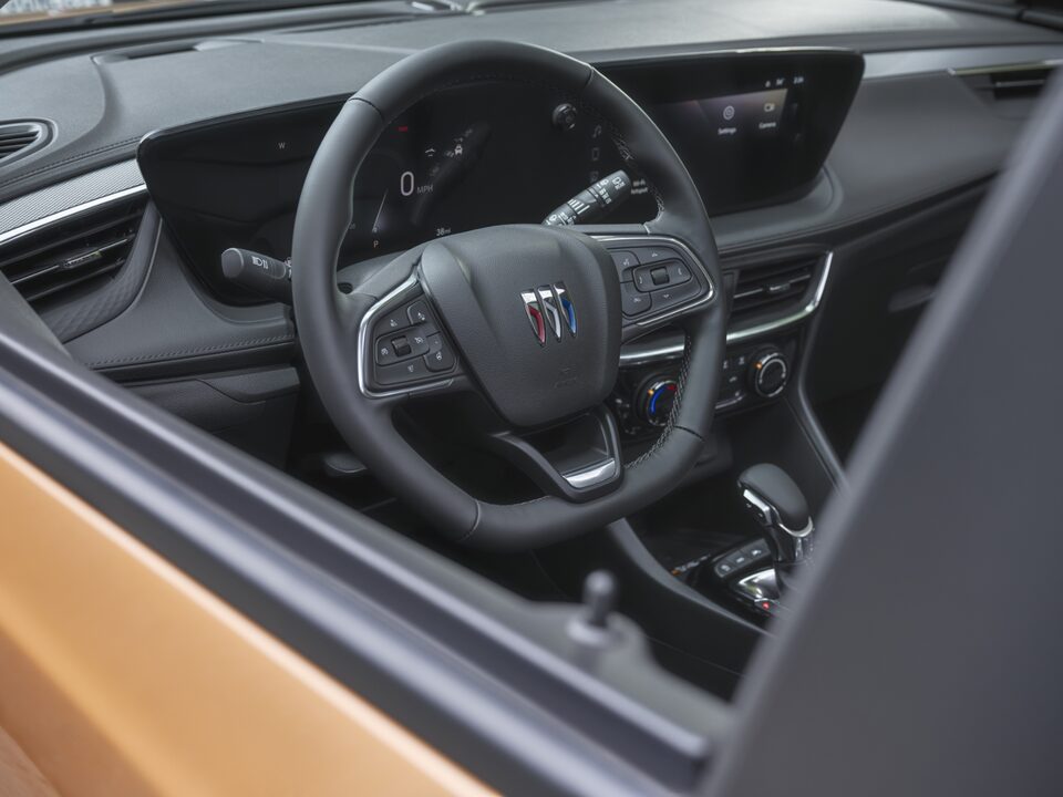 Outsider's view of the steering wheel of the 2024 Encore GX ST.