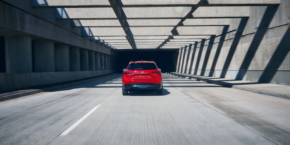 Rear View of the 2026 Buick Envision Compact SUV Driving Down the Freeway.
