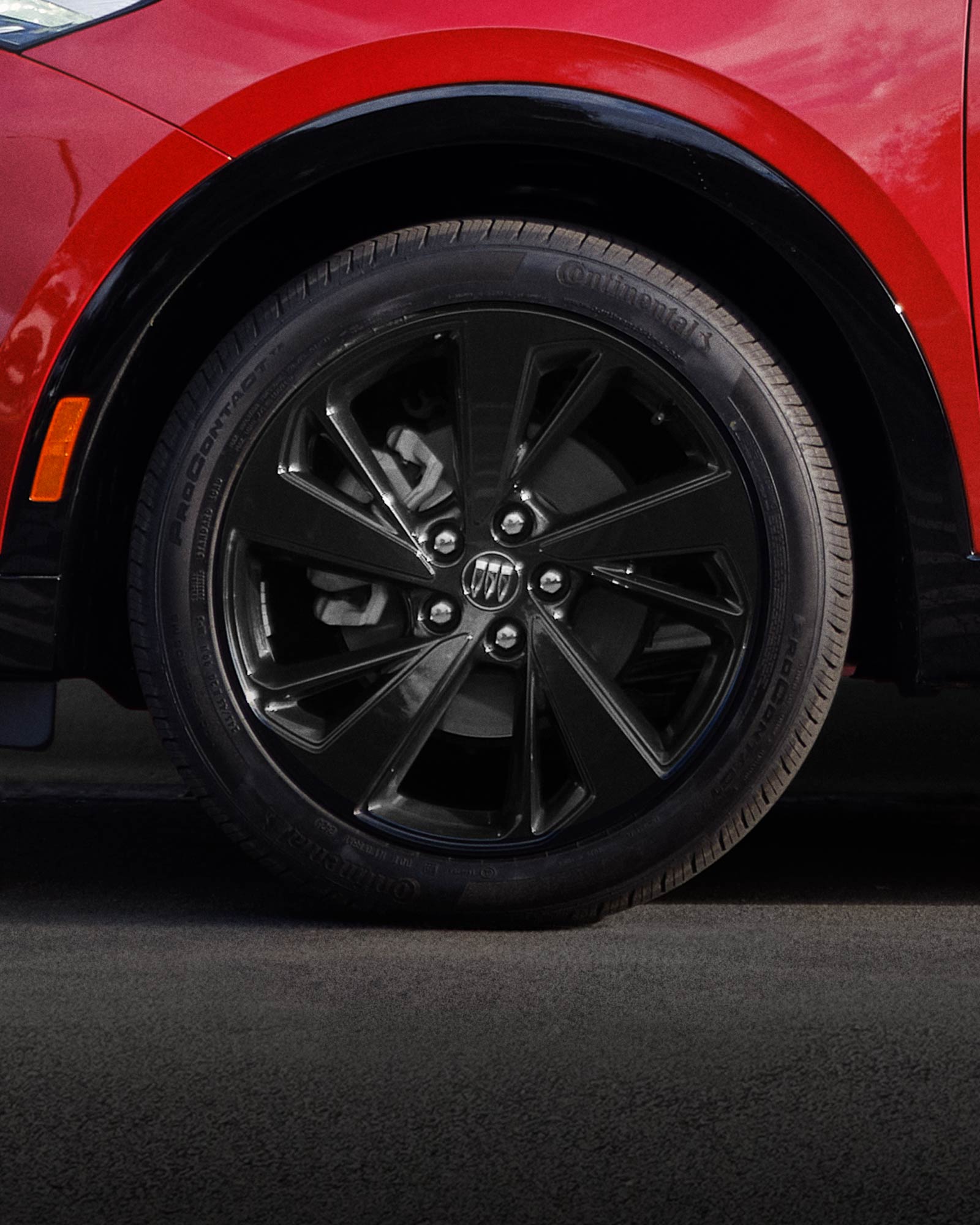 Close-up of the 20 Inch Carbon Flash Metallic Painted Alloy Wheels on the 2026 Buick Envision ST Sporty Compact SUV.