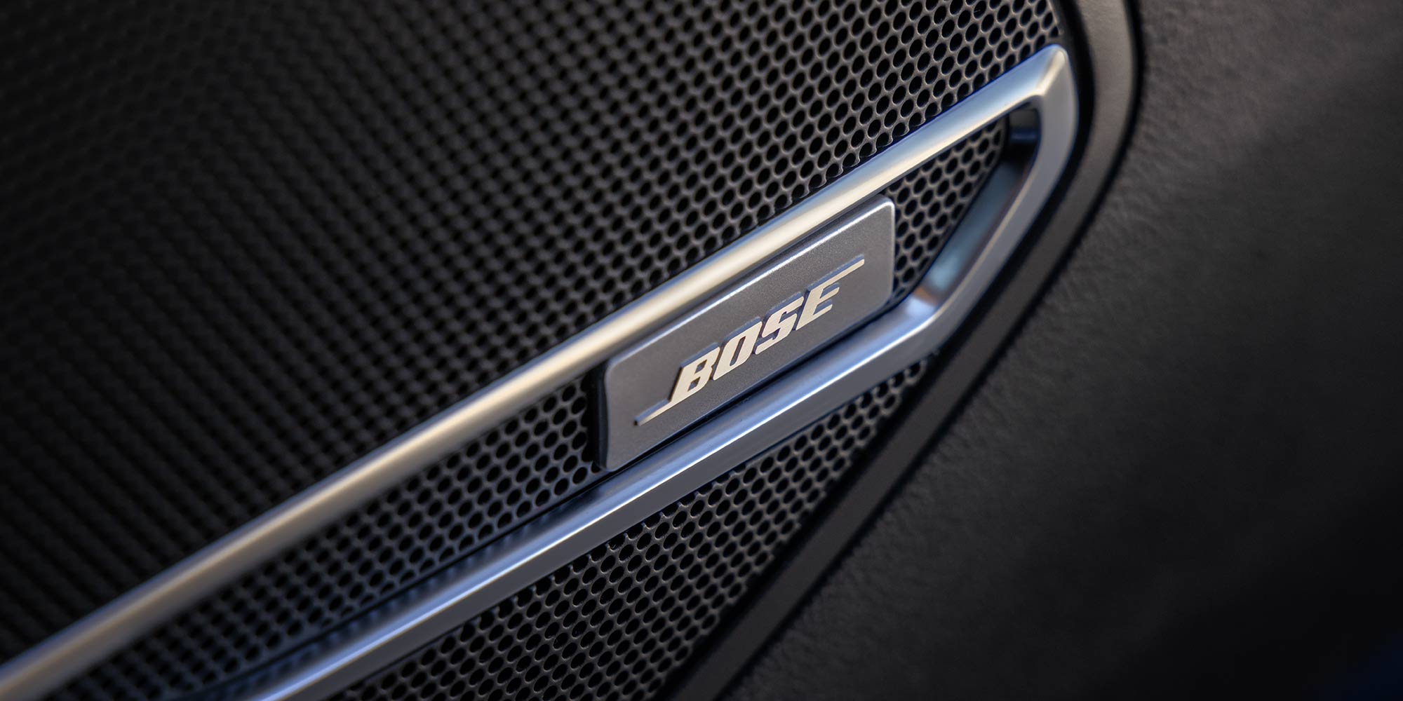 A Close-Up of a Bose Speaker Grille with a Silver Trim in the Buick Envision