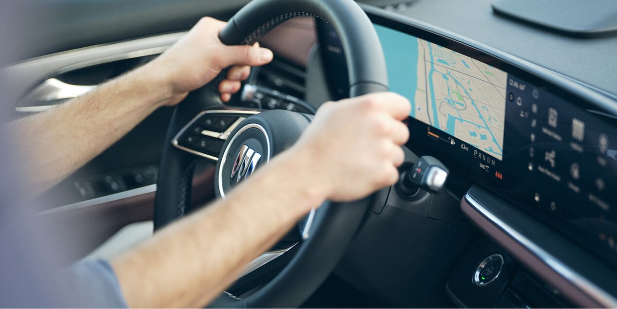Close-up of a Woman Holding the Steering Wheel in her Buick Vehicle