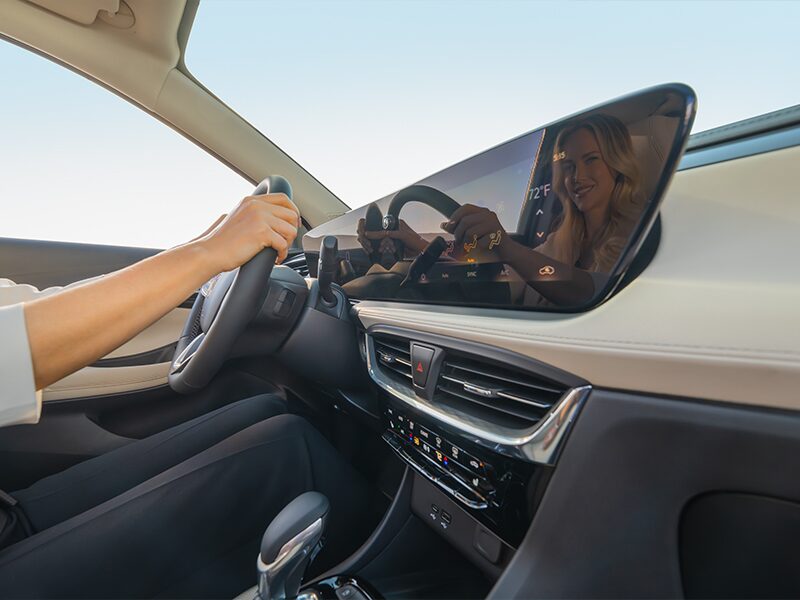 Close-up of a Woman Using the Touch Screen on the Buick Infotainment Screen