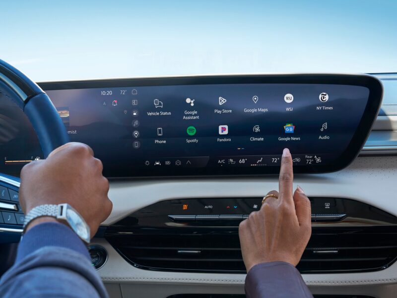 Close-up of a Woman Using the Touch Screen on the Buick Infotainment Screen