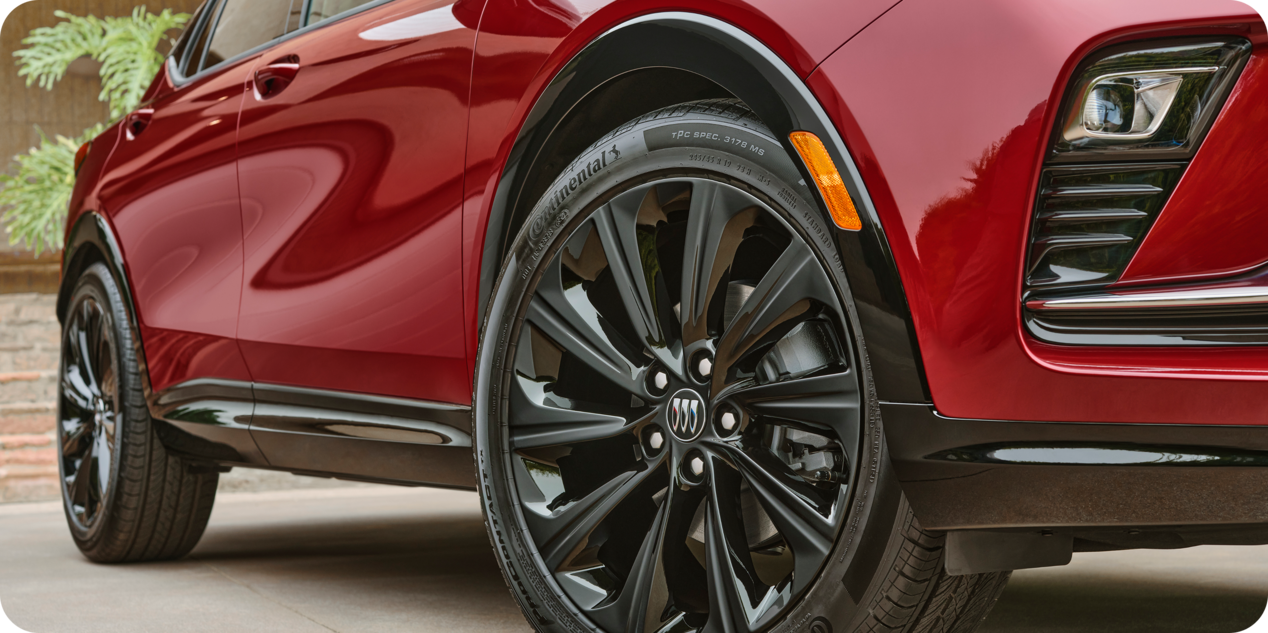 Lower Front Side View of a Red Buick Vehicle Tires