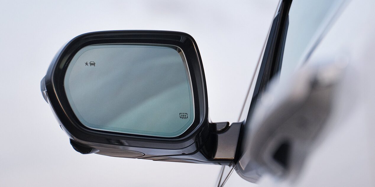 Close-up of the Drives Side Side-View Mirror on a Buick Vehicle
