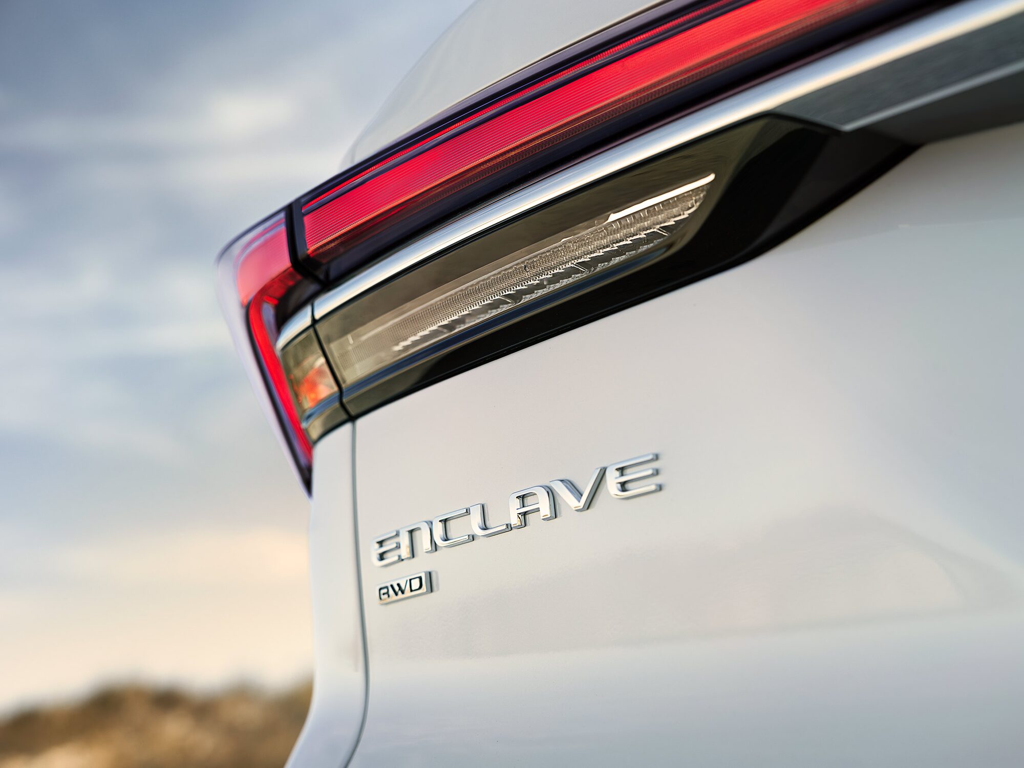 Close-up of a Red Taillight and AWD Badge of a 2025 Buick Enclave