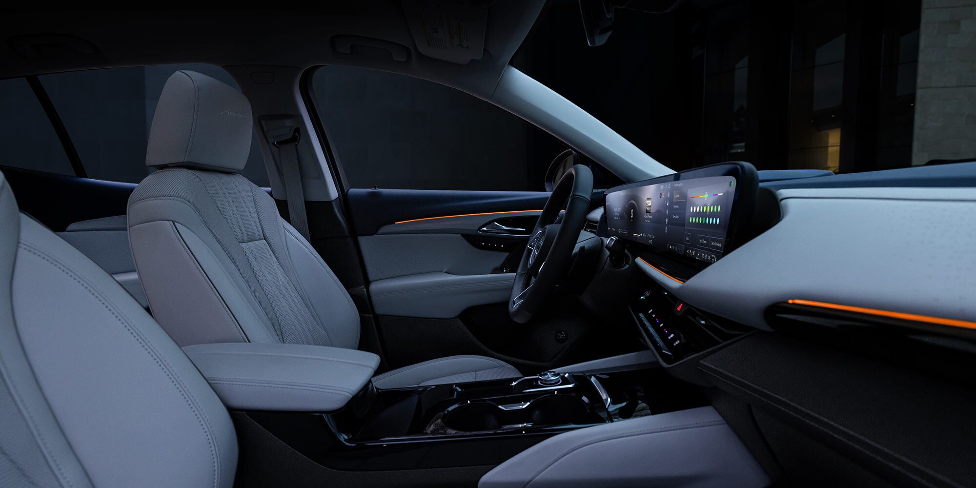 Interior View of a Modern Buick Cabin with Light Grey Seats and a Wide Digital Dashboard