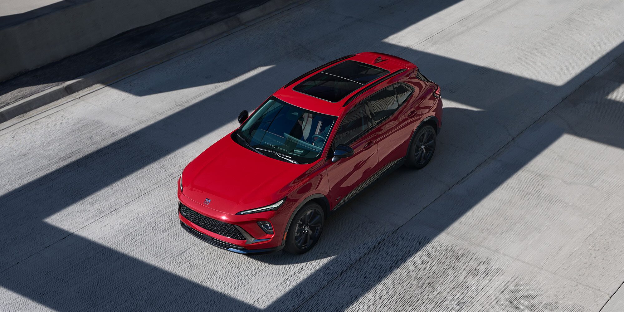 Birds-eye View of the 2026 Enbision Compact SUV Driving Down the Freeway