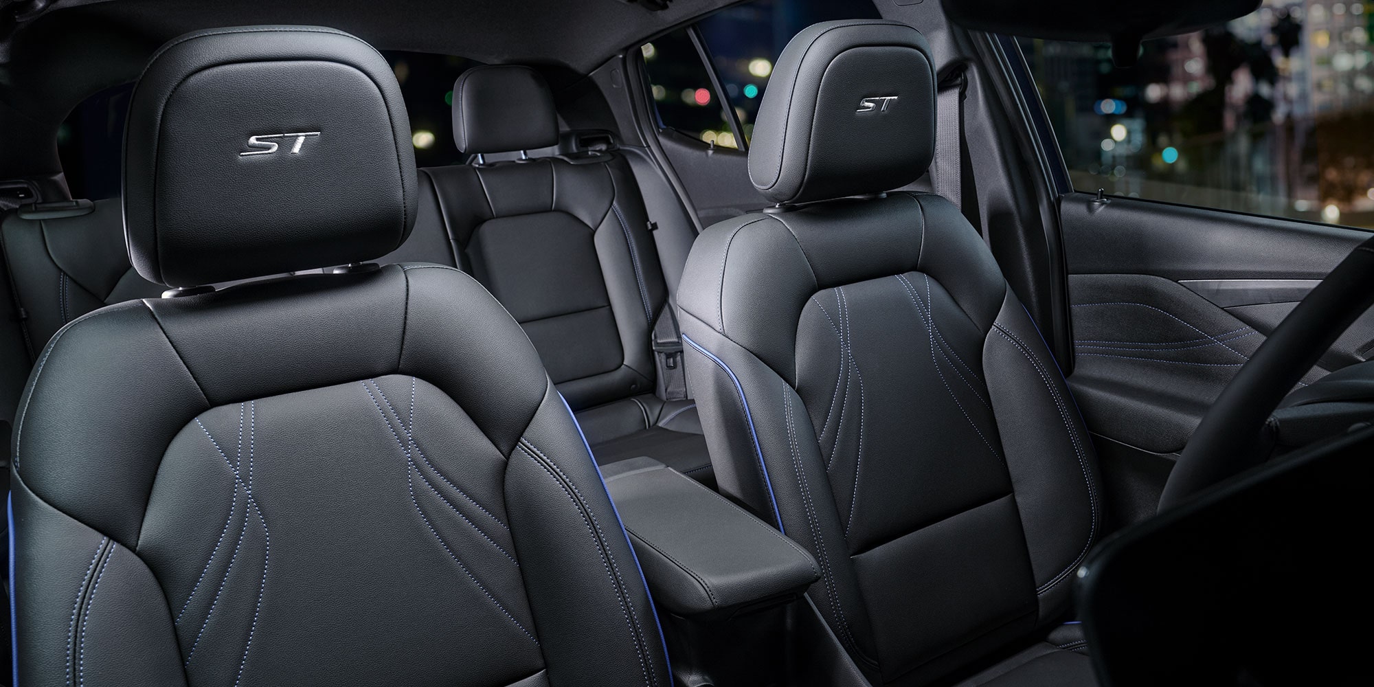 Interior View of the Dark Leather Seating with the Buick ST Badging on the Front Seats Headrests