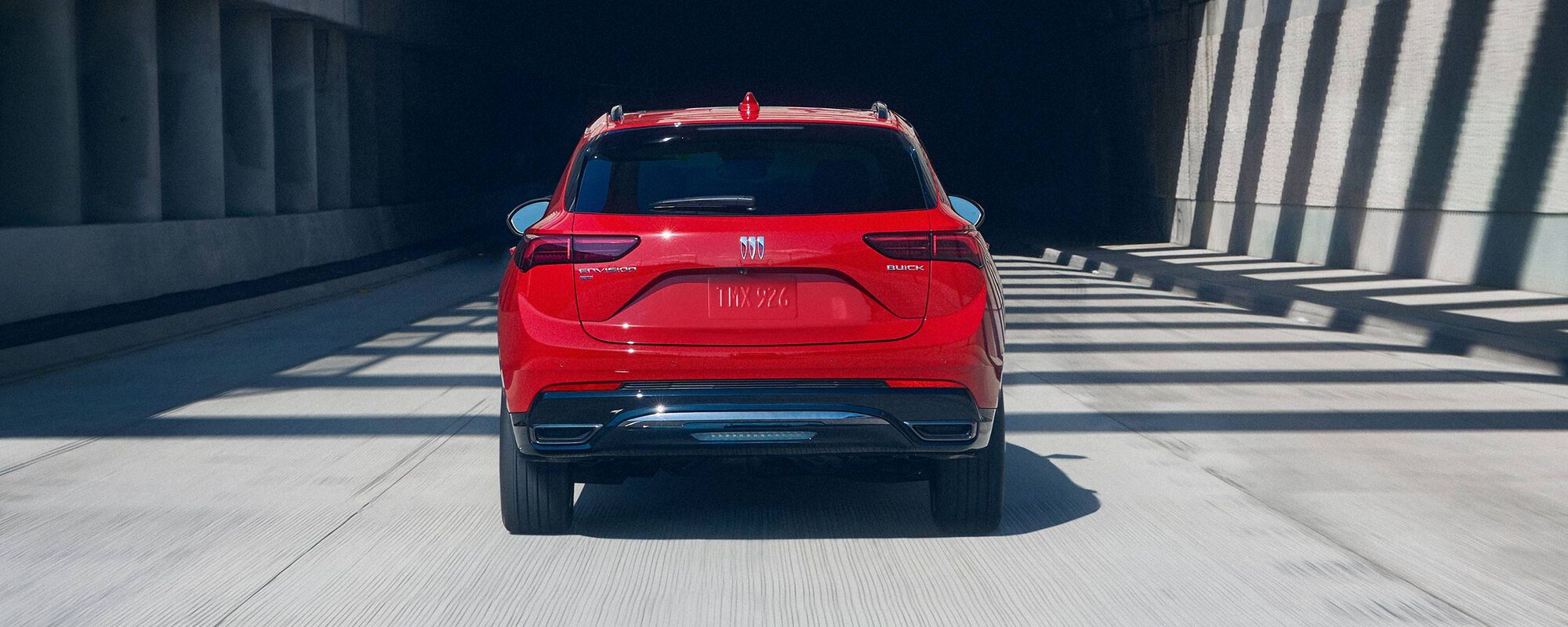 Rear View of the 2026 Buick Envision Compact SUV Driving Down the Freeway