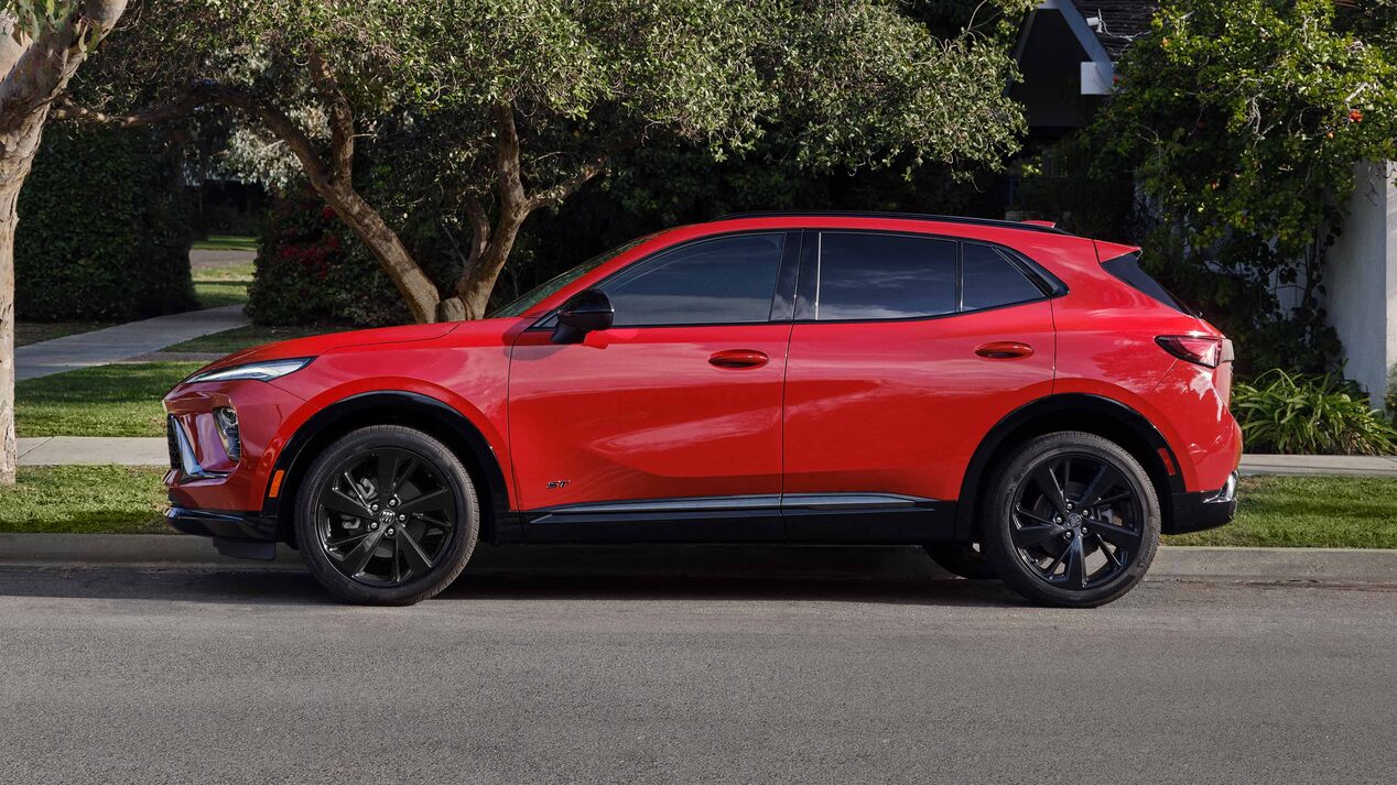 Profile View of a Red Buick Enclave Parked on a Side Street