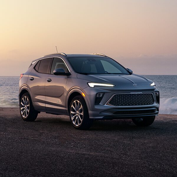 Front Three-Quarters View of the Buick Encore GX Parked on the Beach at Sunset