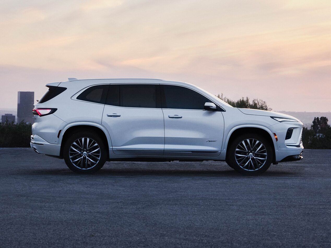Profile View of the Exterior of a White Buick Enclave Mid-Size SUV