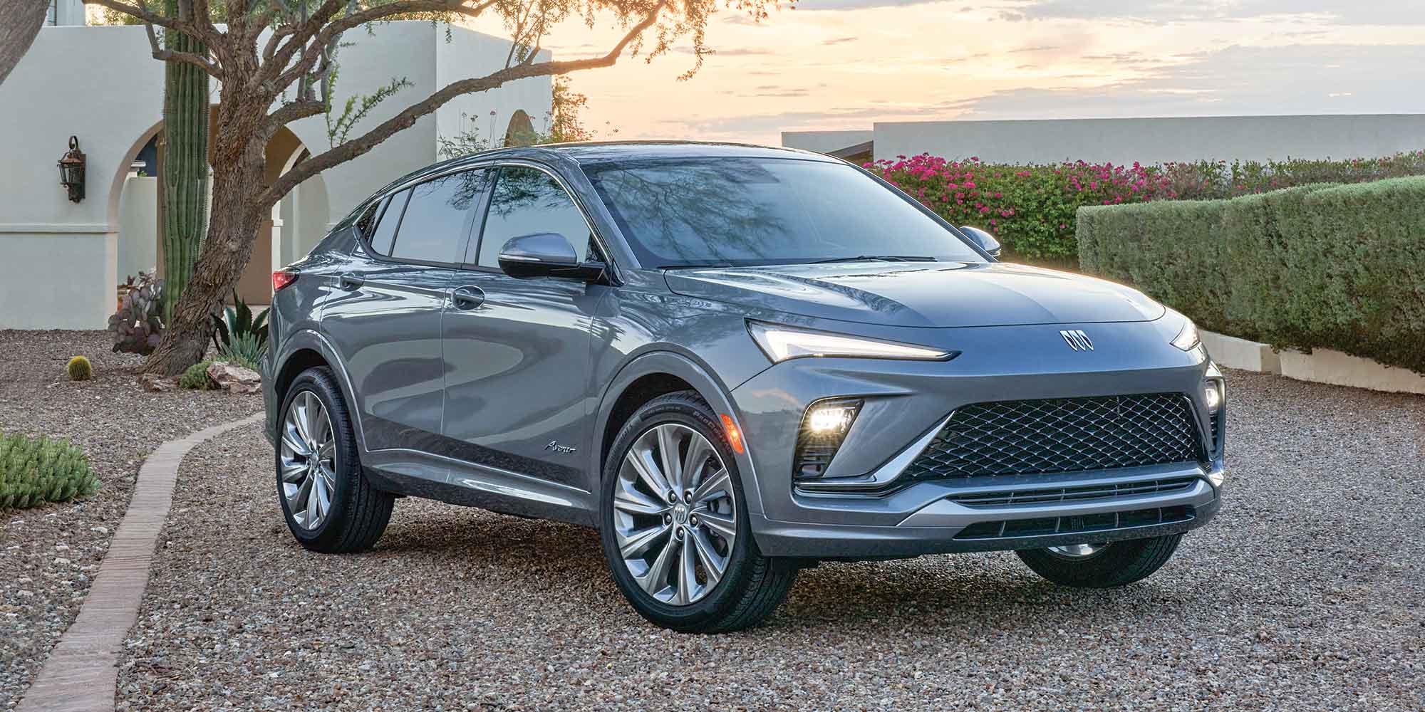 Front View of a 2026 Buick Envista and its Black Ice Chrome Grille Parked Outside of a Home