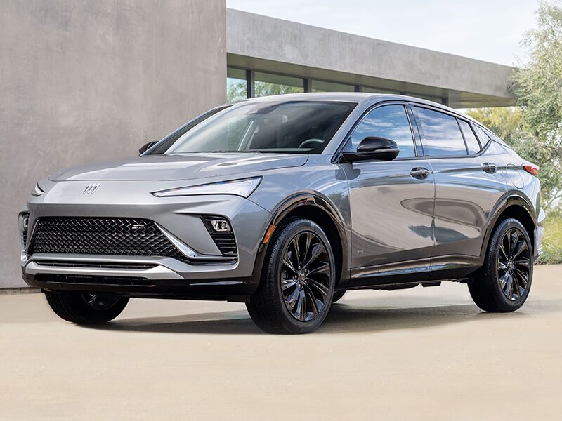 Front Three-Quarters View of the Buick Envista Parked in the Driveway of a Modern Home