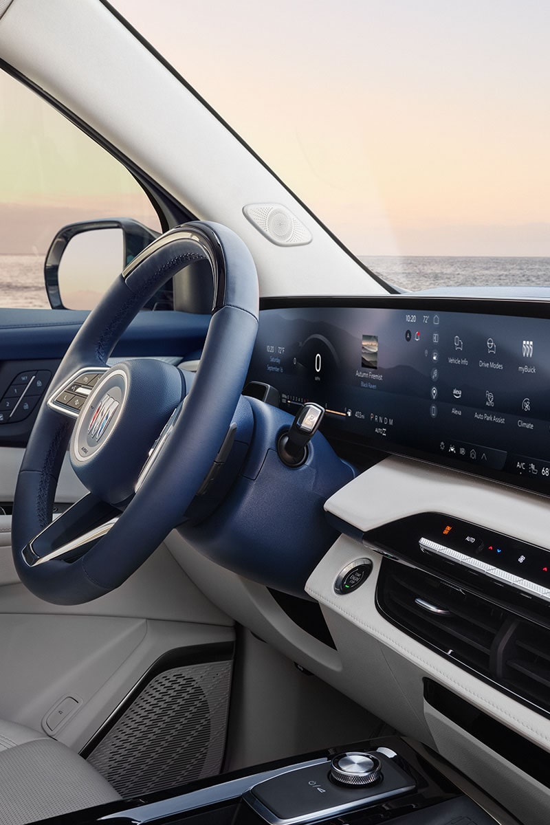 A Beautiful Interior View of the Buick Vehicles Steering Wheel, Dashboard, and Infotainment System