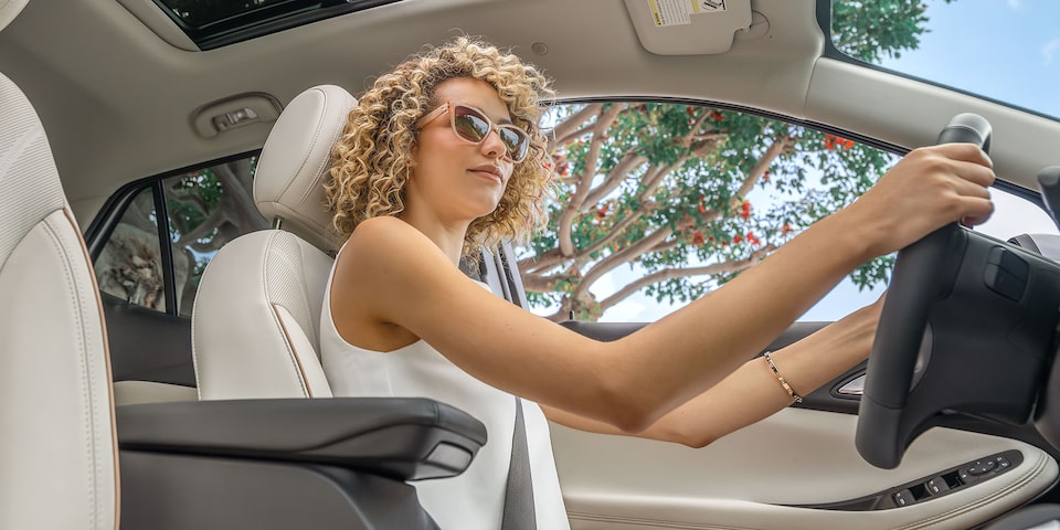A Woman Driving a 2025 Buick Encore GX